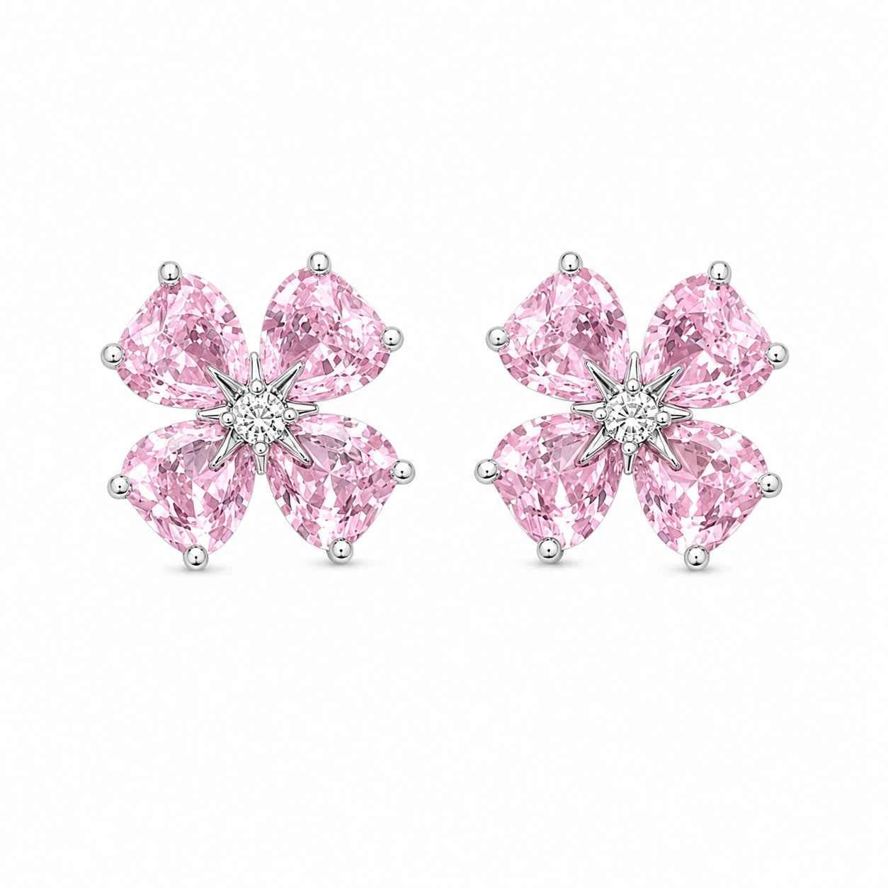 Pair of pink rhinestone flower stud earrings with starburst center