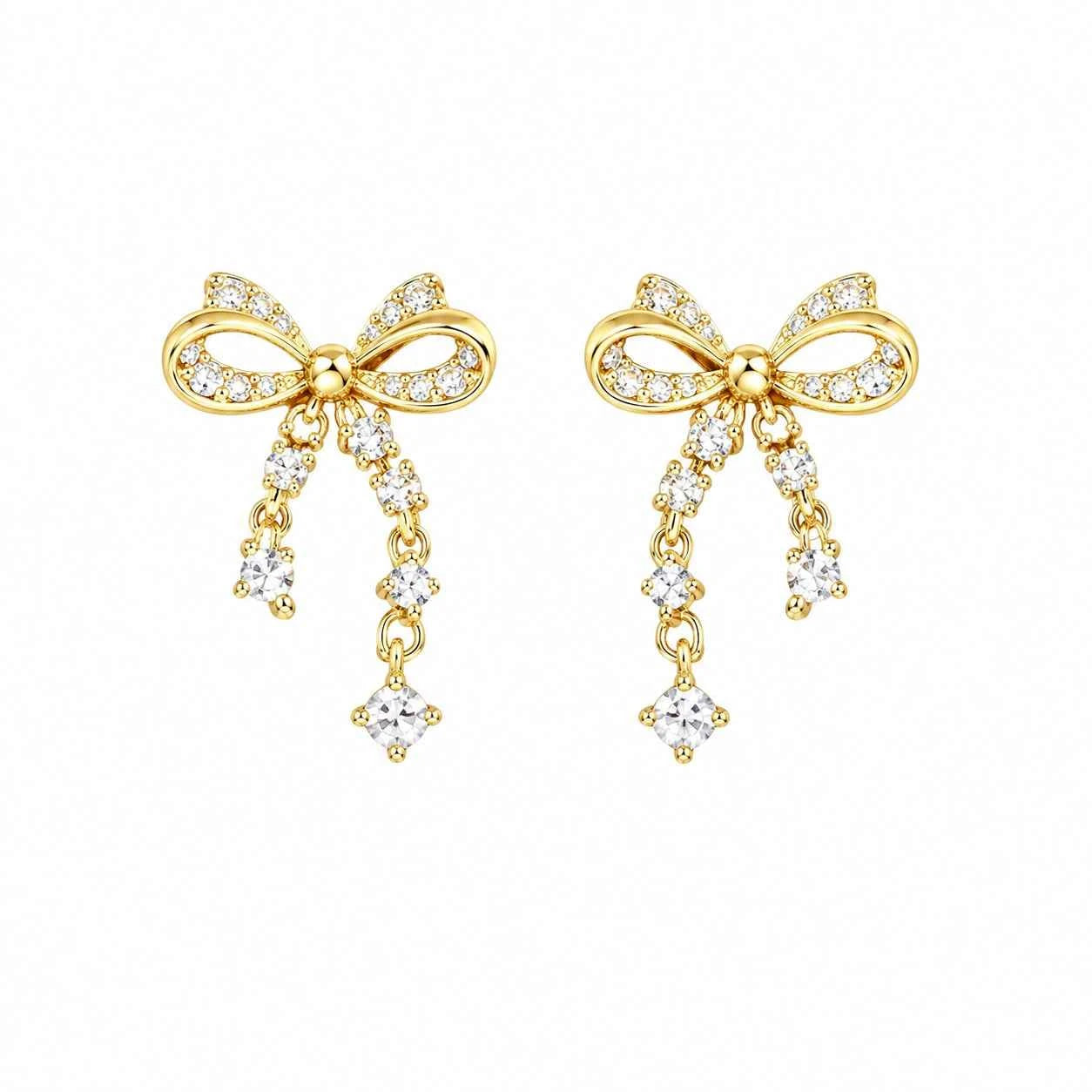Gold bow-shaped drop stud earrings with clear crystals and two dangling teardrops