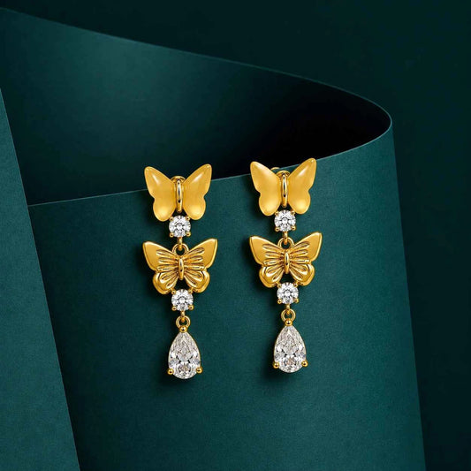 Gold butterfly drop earrings with dangling butterfly and pear teardrop crystal stones.