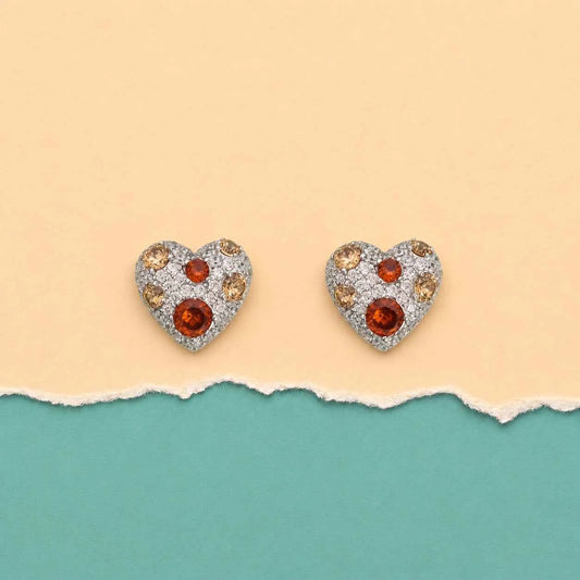Heart stud earrings featuring amber orange and gold-toned rhinestone details
