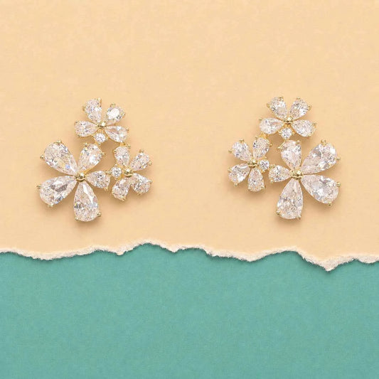 Pair of gold-tone crystal flower stud earrings with three blossom clusters