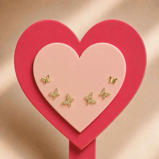 Gold butterfly stud earrings set with five small butterflies and sparkly stones