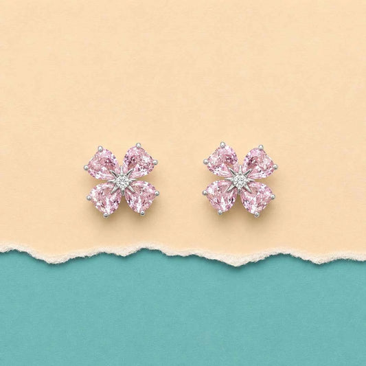 Pink rhinestone flower stud earrings with clustered petals and clear center
