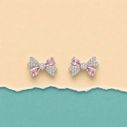 Pair of pink ribbon bow stud earrings, silver sparkle with light pink center stones