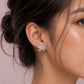 Butterfly stud earrings in 925 silver on ear, with crystal bow detail