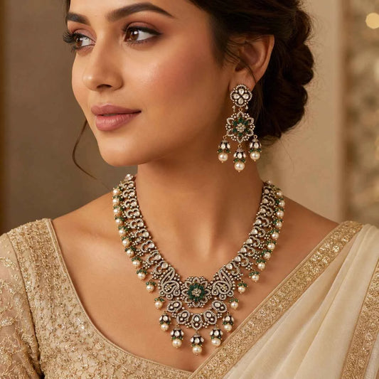 Emerald and pearl necklace set with detailed necklace and drop earrings, worn close-up on model