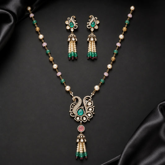 Gold-tone swan pendant necklace with pearl beads and green pink tassel earrings