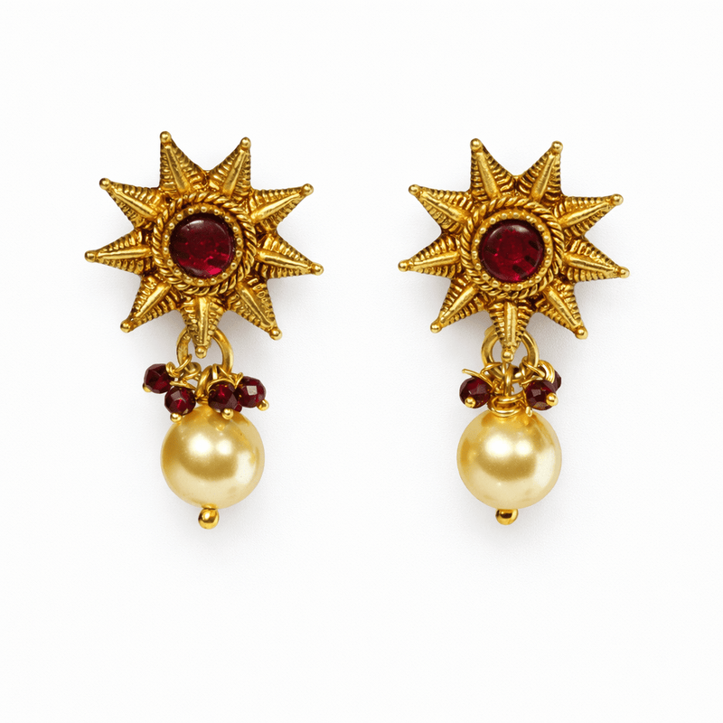 Antique gold sun motif stud earrings with ruby center and pearl drop dangling