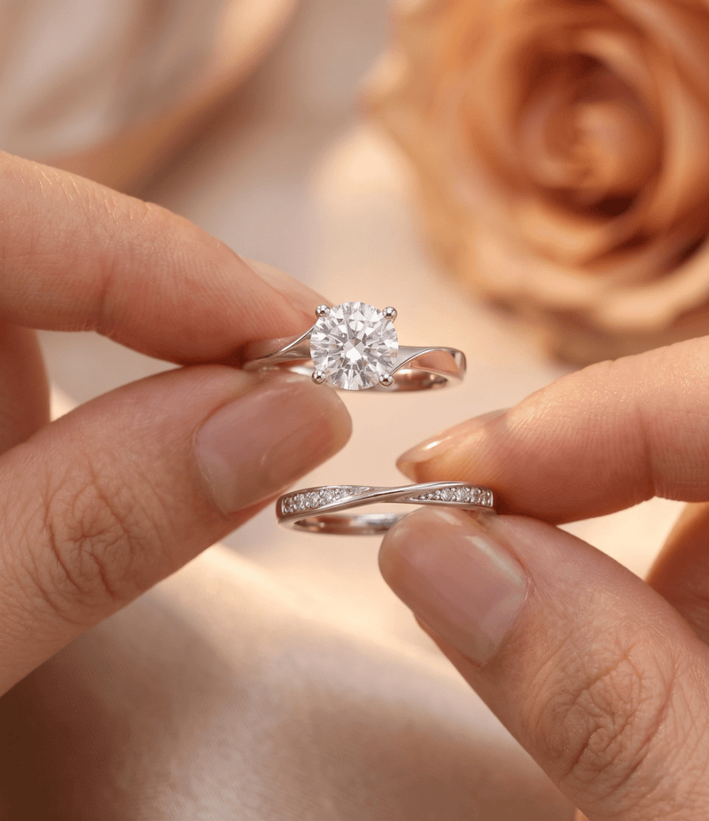 Silver dual ring set close-up, round diamond-look center stone with twist band