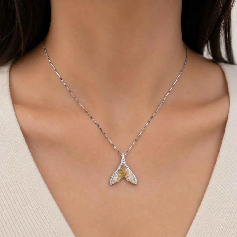 925 silver wing pendant necklace on a model, two arched wings with stones