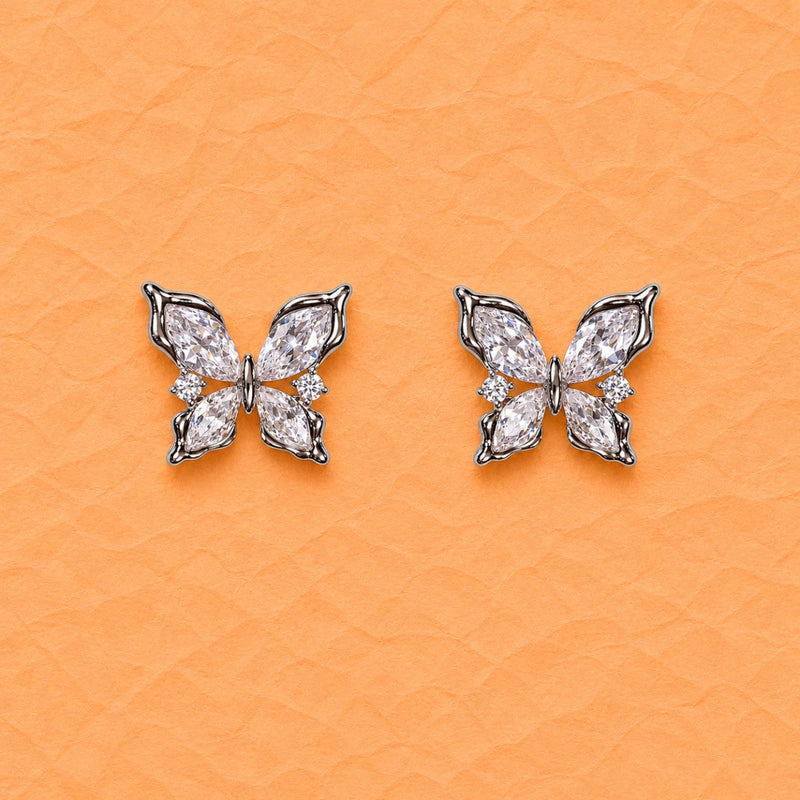 Pair of silver butterfly crystal stud earrings with clustered marquise stones