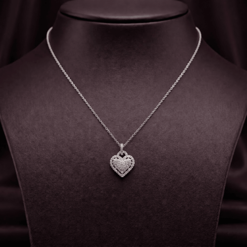 Silver heart sparkle pendant necklace with chain, framed by rhinestone texture.