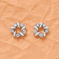 Silver cubic zirconia star stud earrings with round stones in swirl frame