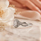 Elegant Round Halo Infinity Twist Diamond Engagement Ring