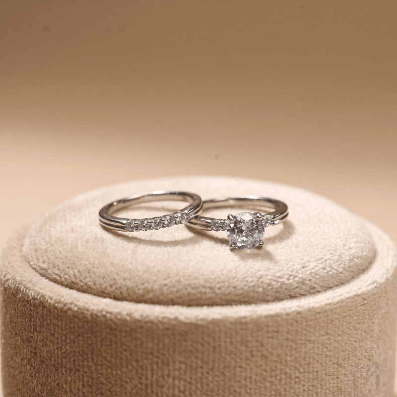 Sterling silver ring set with round solitaire and accent stone band