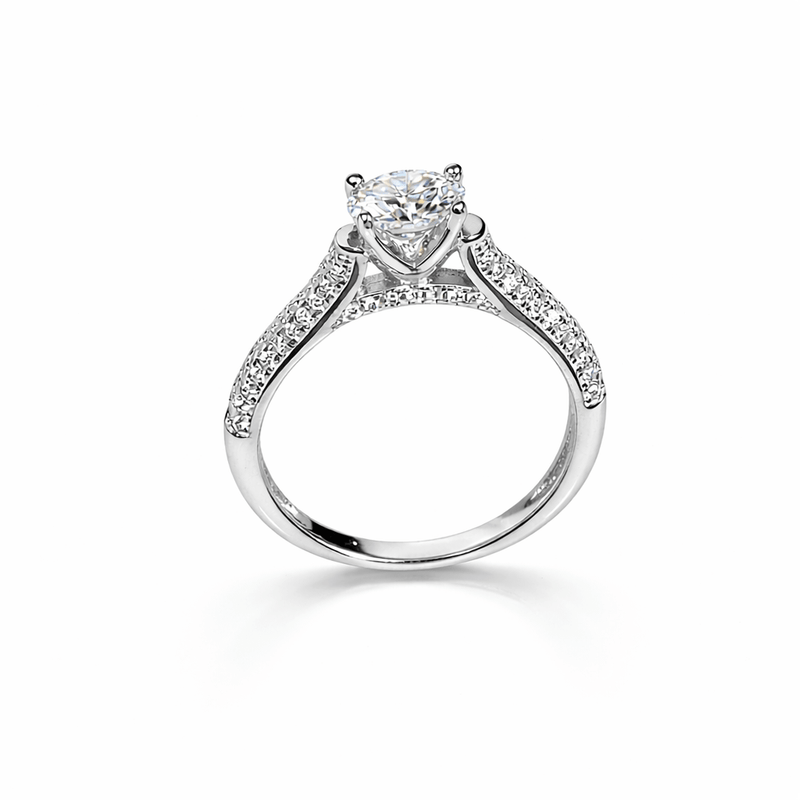 Silver solitaire ring with round center stone and pavé halo band
