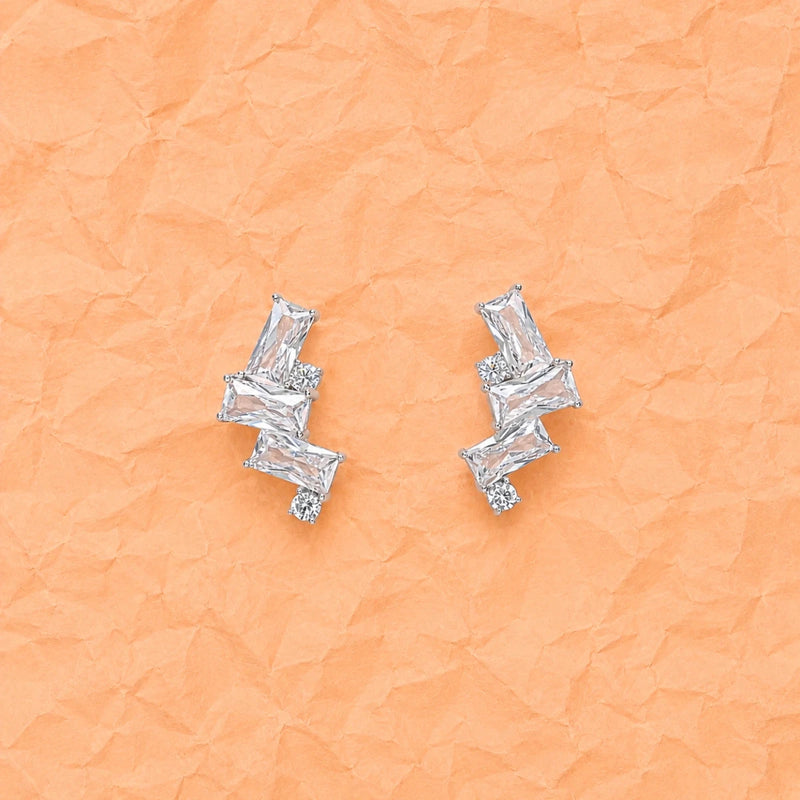 Geometric triple zirconia stud earrings in 925 silver, angled pair with baguette stones