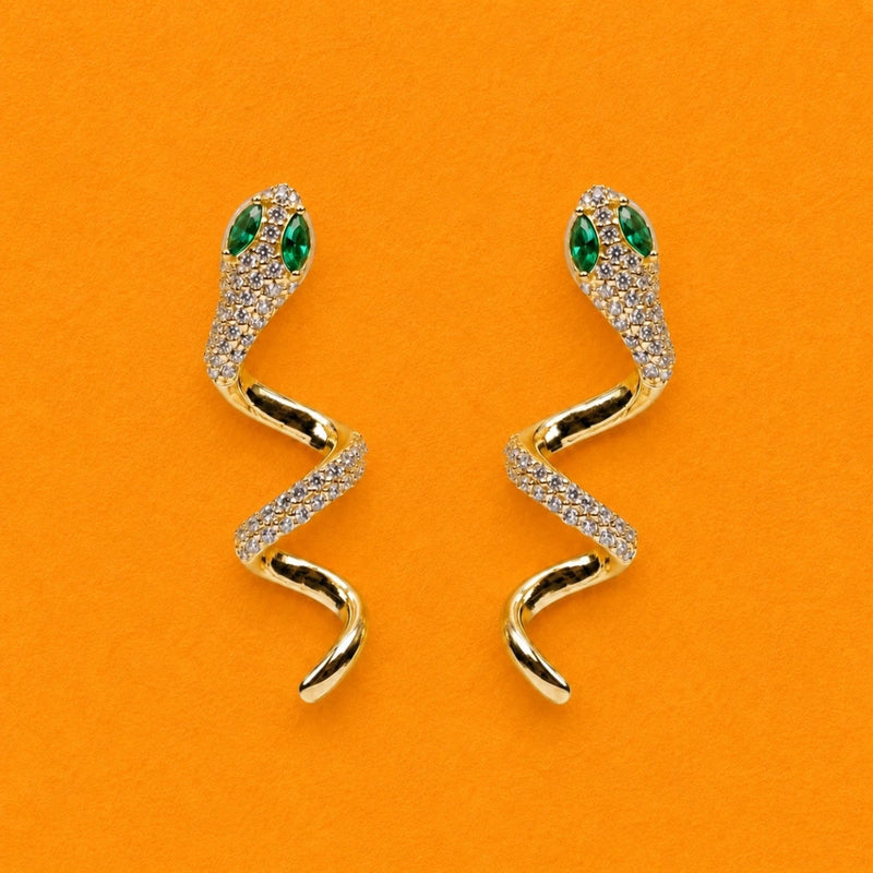 Gold-tone snake crystal drop earrings with green teardrop stones and clear pavé