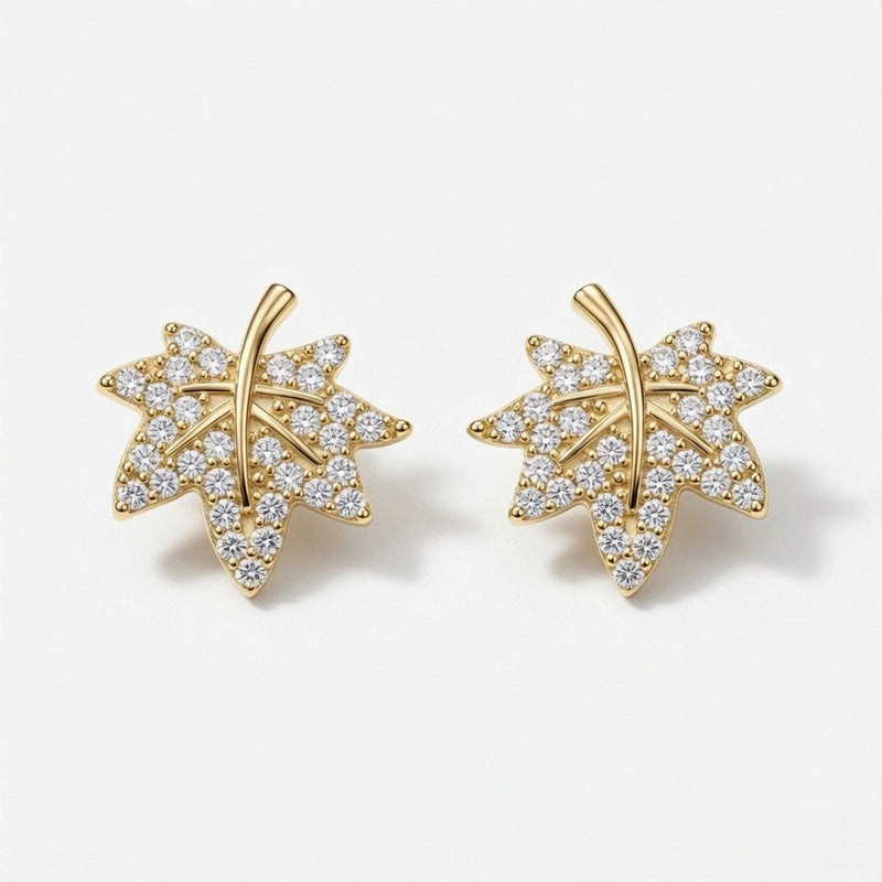Pair of maple leaf crystal stud earrings in gold-tone with 925 silver posts