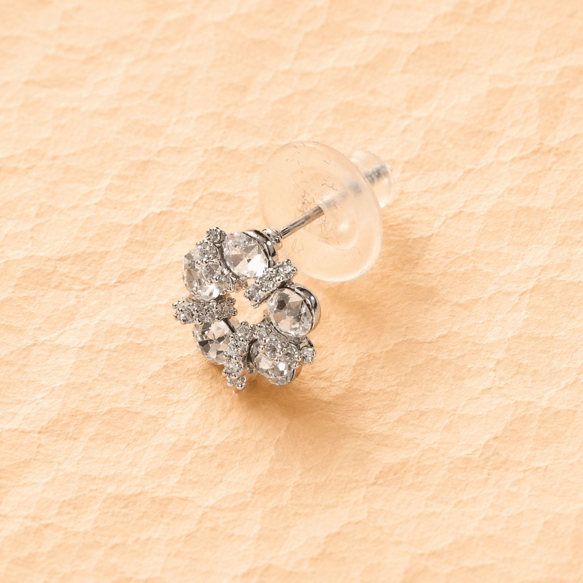 Silver halo circle bar stud earring with round crystal stones on a post.