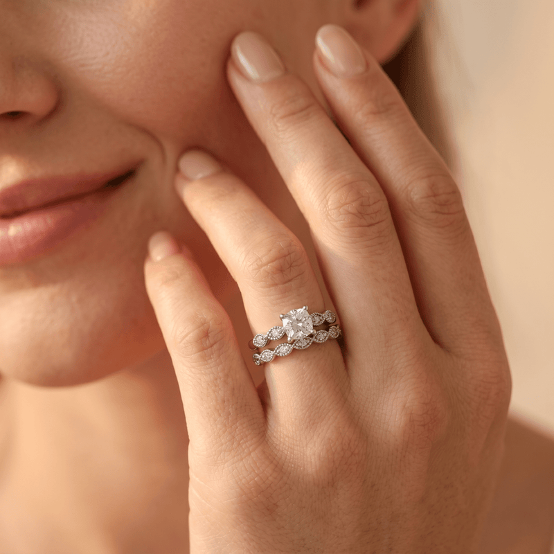 925 silver dual ring on finger, oval center stone with smaller pavé details