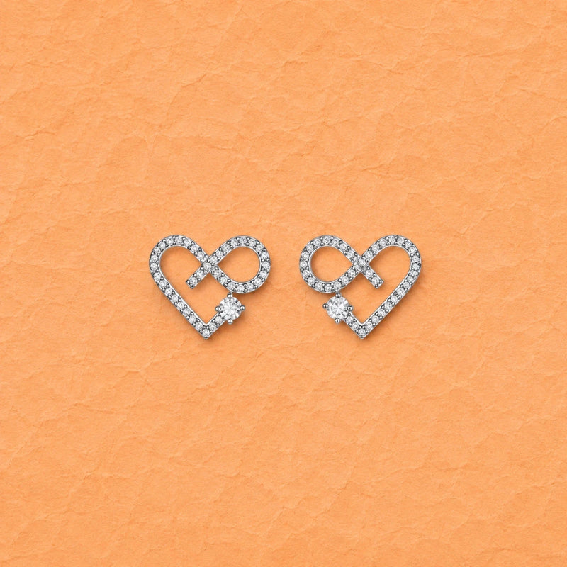 Infinity heart crystal stud earrings in silver with sparkling pavé detail
