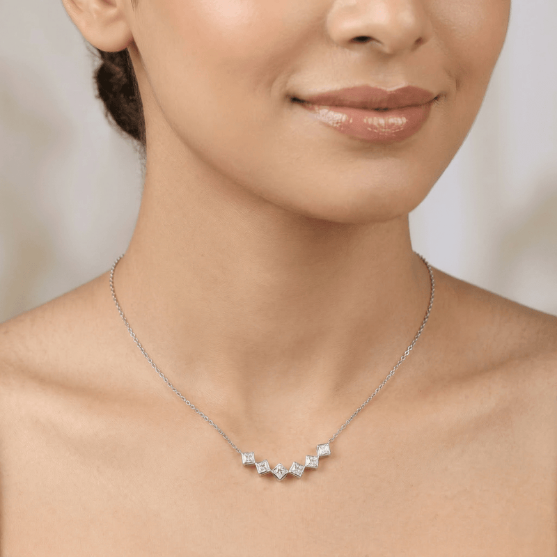 925 silver geometric necklace worn on neckline with five square settings
