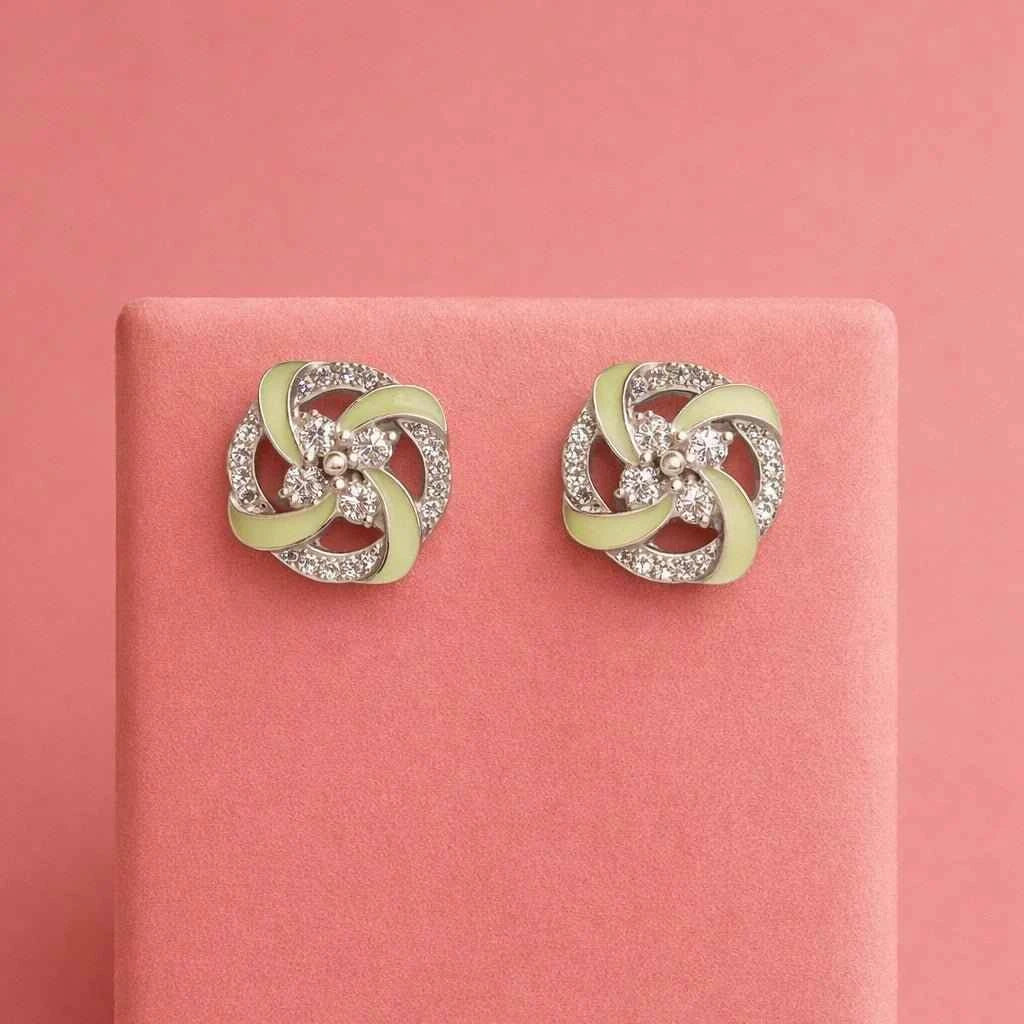 Mint green swirl pinwheel stud earrings in silver-tone with clear stone details
