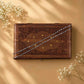 925 silver anklet chain laid across a wooden keepsake box
