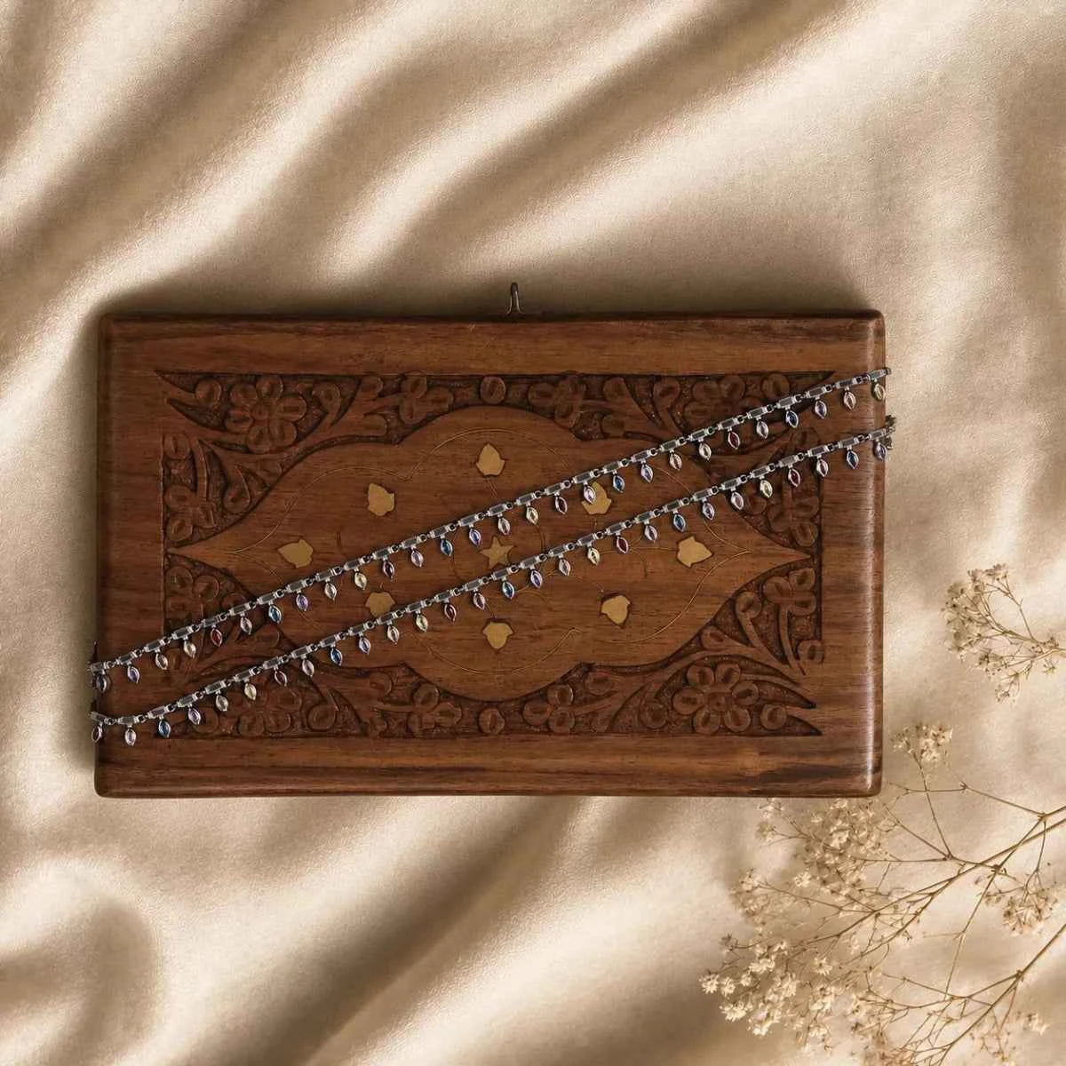Brown patterned leather pouch with silver-tone chain strap