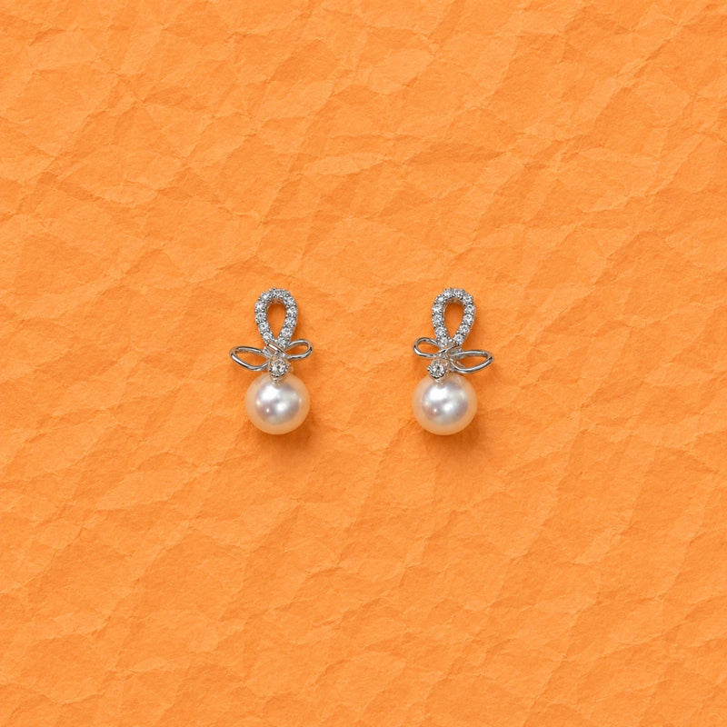 Silver drop stud earrings with a bow zirconia frame and white pearl