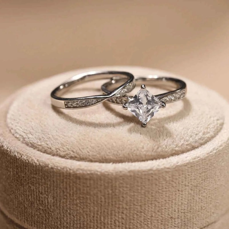 Sterling silver ring set with princess-cut solitaire and twisted pavé band