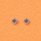 Clover-shaped purple crystal stud earrings with round silver halo detailing