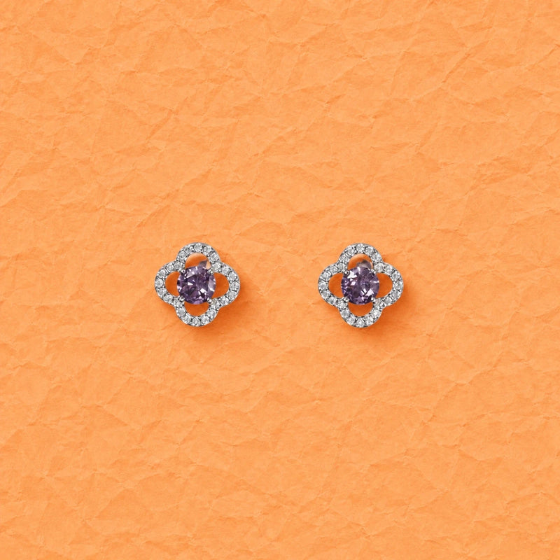 Clover-shaped purple crystal stud earrings with round silver halo detailing