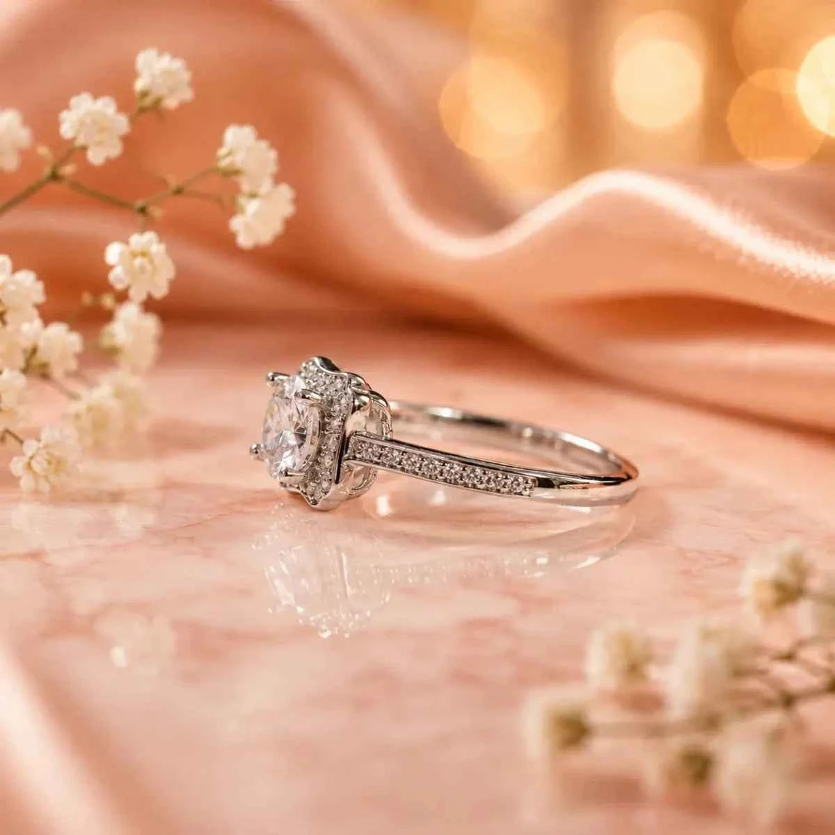 Sterling silver halo ring with square center stone and pavé shoulders