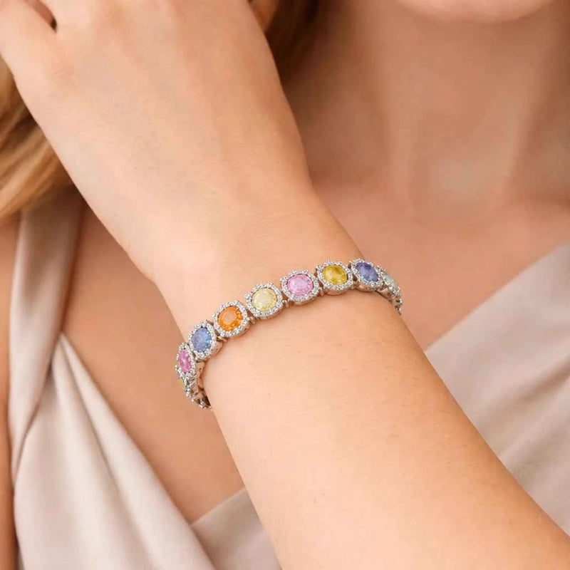 Rainbow halo gemstone bracelet in silver with round multicolor stones on wrist