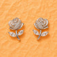 Silver cubic zirconia rose stud earrings with three leaf accents
