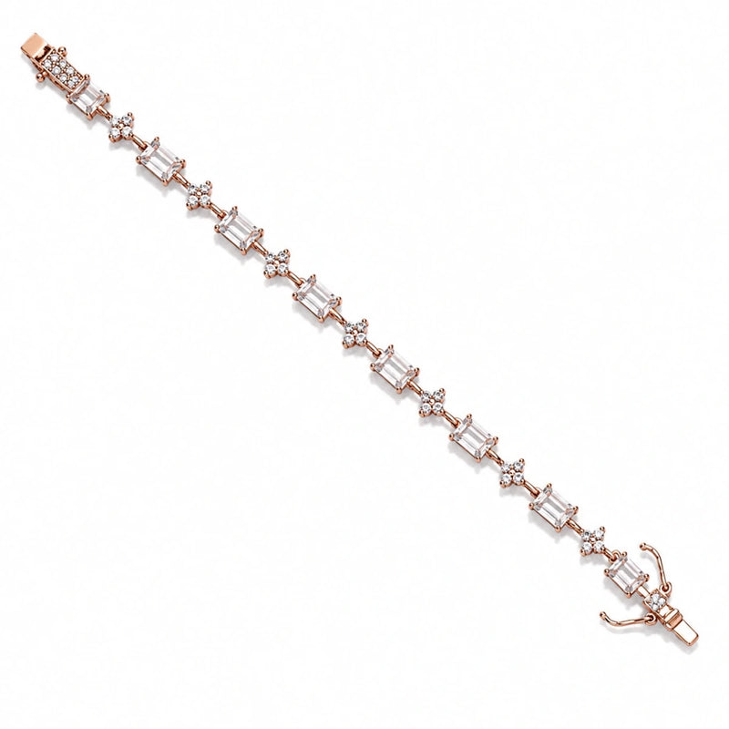 Rose-gold tennis bracelet with emerald-green and clear stones and lobster clasp.