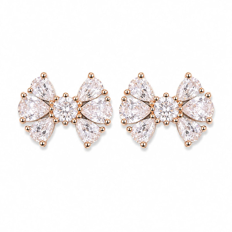 Crystal bow stud earrings, rose gold tone prong settings with clear stones