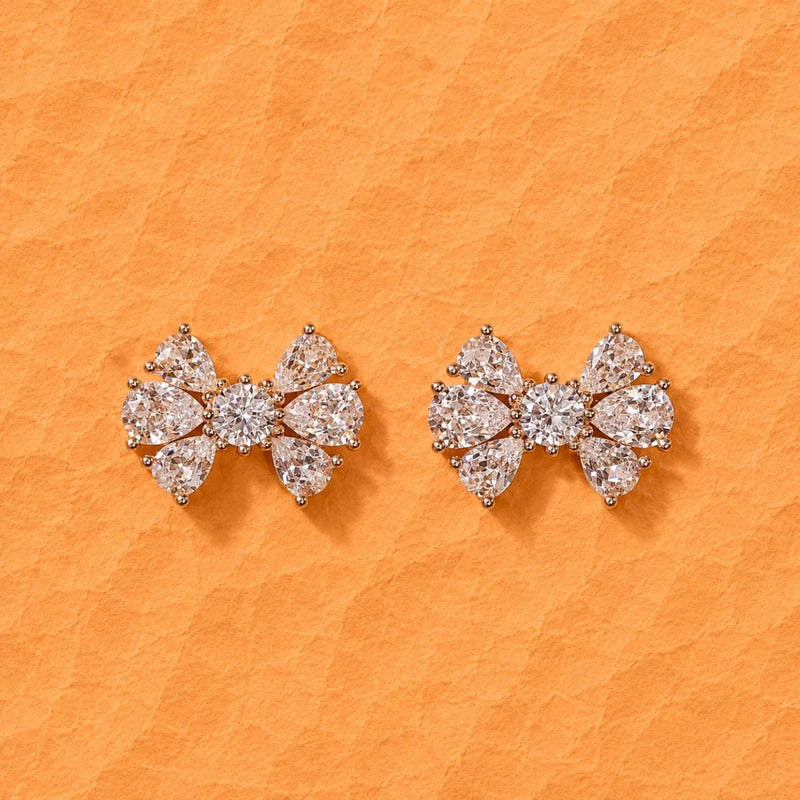 Crystal bow stud earrings with clear pavé stones, rose gold tone setting