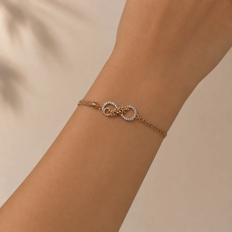 Rose gold eternal knot bracelet worn on wrist with linked chain and knot charm