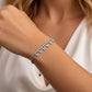 CZ butterfly link bracelet on wrist, silver band with repeating sparkly links