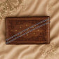 925 silver beaded anklet pair with small charms, laid diagonally on wooden box