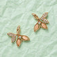 Petal stud earrings with pink enamel petals and clear crystal sparkle, gold-tone pair