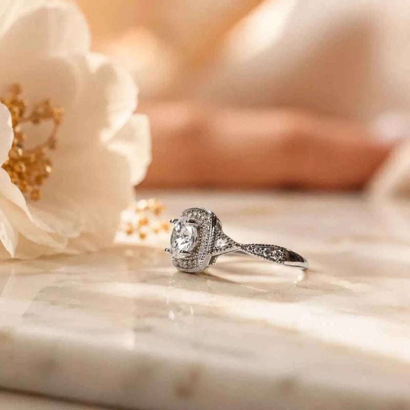 Sterling silver halo ring with round center stone and twisted pavé band